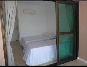 Cama ou camas em um quarto em Beverly Hills-Porto das Dunas-Cobertura