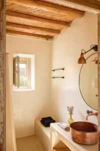 a bathroom with a sink and a mirror at Great View, Small Villa in Rámos