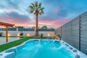 a pool in the backyard of a house with a palm tree at Palm & Spa in Barbaliáki