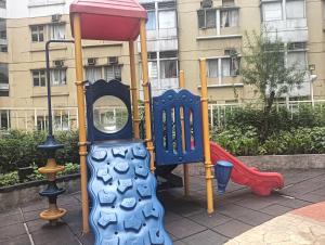 a playground with two play equipment in a city at Xian's place Budget Friendly Condo in Manila