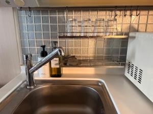 Kuchyň nebo kuchyňský kout v ubytování Incheon Airport Stay Guesthouse + 16 fotografií