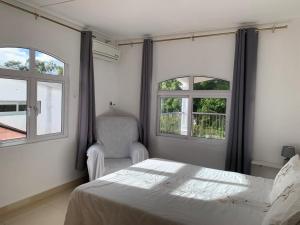 Postel nebo postele na pokoji v ubytování Beejan Mansions