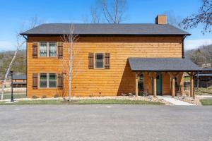a small wooden house with a black roof at Cloverleaf Cottage in Hollister