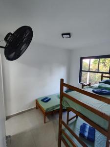 Ένα ή περισσότερα κρεβάτια σε δωμάτιο στο Pássaros e Flores