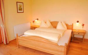 Postel nebo postele na pokoji v ubytování Weingut Winzerhof Gästezimmer Grebenz