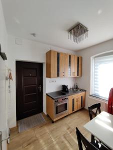 A kitchen or kitchenette at Amstetten Apartment