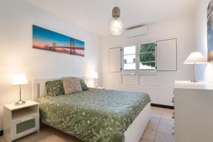 a bedroom with a bed and a bridge on the wall at Villa Calima Deluxe con Piscina in Tías +22 photos