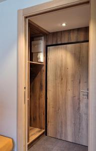 a sliding glass door in a room at Studio Ariondaz in Courchevel +3 photos