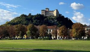 a castle on top of a hill in a park at La casa di Giò in Angera