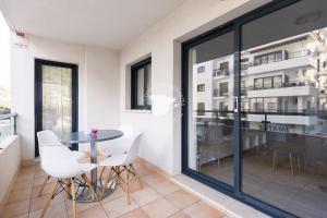 a dining room with a table and chairs at Apartment El Sol in Moraira