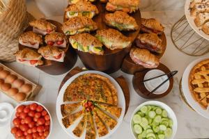 a table topped with lots of different types of food at Hotel Marco Polo in Lido di Jesolo