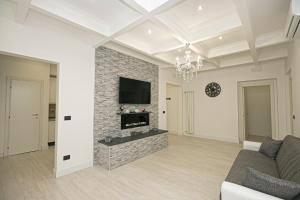 a living room with a couch and a fireplace at Guest House Genova Holiday in Genova