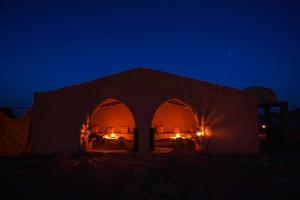 a tent in the desert at night at Bivouac Rêve Sahara-Dar Azawad in Mhamid