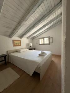 Postel nebo postele na pokoji v ubytování Dimoulitsa Villas Complex