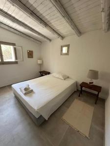 Postel nebo postele na pokoji v ubytování Dimoulitsa Villas Complex + 40 fotografií