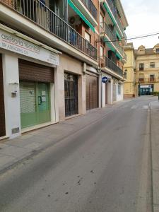 an empty street in a town with buildings at Apto Estudio I Santa Clara Centro in Antequera