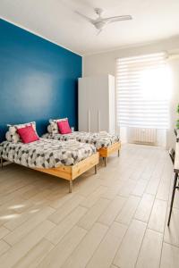 A bed or beds in a room at Tirelli Apartment Roma