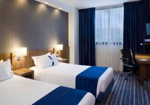 En eller flere senge i et værelse på Holiday Inn Express Campo de Gibraltar-Barrios, an IHG Hotel