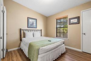 a bedroom with a bed and a window at Evergreen Ridge 27 in Kimberling City +53 photos