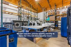 a laundry room with washing machines and a table at Evergreen Ridge 27 in Kimberling City