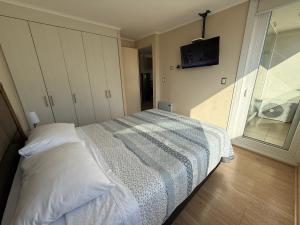 Postel nebo postele na pokoji v ubytování Departamento Chillan céntrico