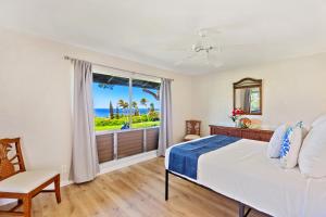 a bedroom with a bed and a view of the ocean at Kaanapali Plantation 6 in Lahaina +42 photos