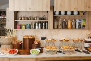 a buffet with many different types of food on display at Hotel Marco Polo in Lido di Jesolo