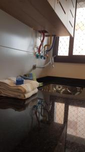 a room with a sink and a counter with water at Gerizim in Vila Velha