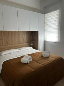 Postel nebo postele na pokoji v ubytování La Perla nel Vico