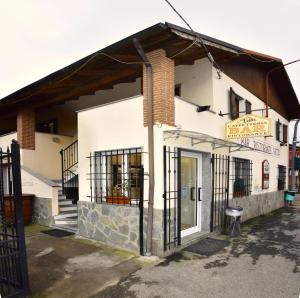 a building with a sign on the side of it at Appartamento Vetta Cremolino in Cremolino