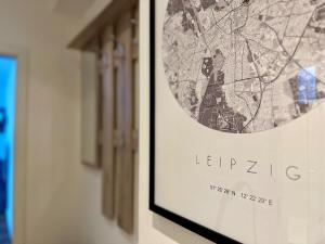 a framed picture of a map on a wall at Ferienwohnung am Bayrischen Bahnhof in Leipzig