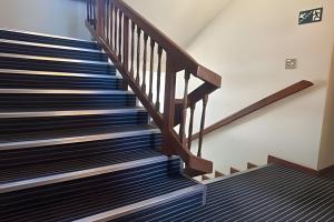 a staircase in a building with black and blue stairs at LN Flats & Suites in Uberlândia