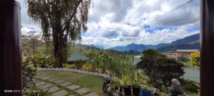 a view of a garden with mountains in the background at Saint Joseph Inn in Sagada +29 photos