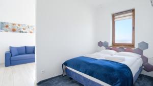 Łóżko lub łóżka w pokoju w obiekcie Apartamenty Sun & Snow BLUE II