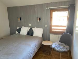 Ένα ή περισσότερα κρεβάτια σε δωμάτιο στο Appartement Parc Aux étoiles +32 φωτογραφίες