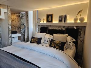 a bedroom with two beds with pillows at Be Your Home - My Attitude in Civitavecchia