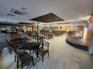 Um restaurante ou outro lugar para comer em Hotel Morada do Sol