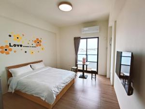 Postelja oz. postelje v sobi nastanitve Endless Summer Homestay