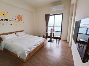Postelja oz. postelje v sobi nastanitve Endless Summer Homestay