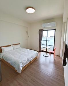 Postelja oz. postelje v sobi nastanitve Endless Summer Homestay