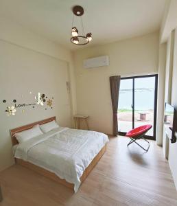 Postel nebo postele na pokoji v ubytování Endless Summer Homestay