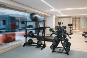 a fitness room with a lot of exercise equipment at Plus Fariones Suite Hotel in Puerto del Carmen
