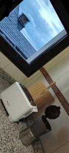 a counter top with a hair dryer and a knife at Mirador de Usil in Mogro +19 photos