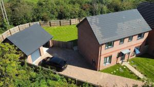 an aerial view of a car parked in front of a house at Large 4 Bedroom House - 15 Mins to Cardiff Central in Cogan