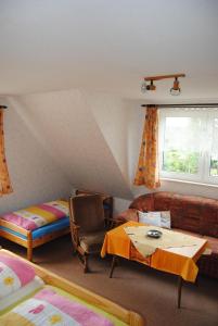 a living room with a couch and a table at Schule 8 in Windeby