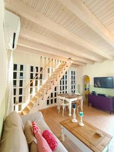 a living room with a couch and a table at "Wonderland" Nest Nafplio in Nafplio