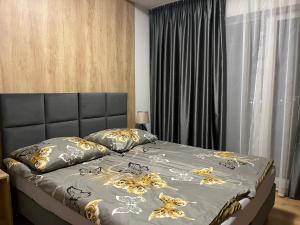 Postel nebo postele na pokoji v ubytování Apartamenty Na wzgórzu