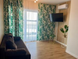 TV a/nebo společenská místnost v ubytování Apartamenty Na wzgórzu