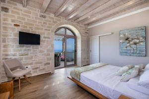 Posteľ alebo postele v izbe v ubytovaní Villa AuroraLuxurius Living