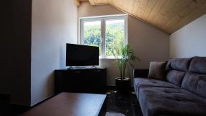 TV a/nebo společenská místnost v ubytování Mountain Maison